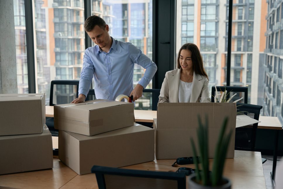 Young corporate workers preparing for office relocation