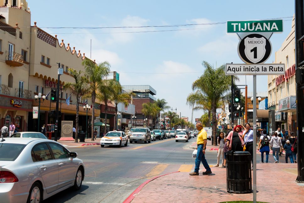 TIJUANA, BAJA CALIFORNIA/MEXICO - JUNE 20, 2018: People walk along Avenida Revolucion, the city's main thoroughfare and a popular destination for Americans traveling south of the San Diego border.