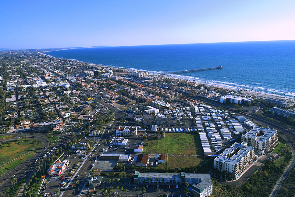 an aerial view of a North County San Diego city by the ocean