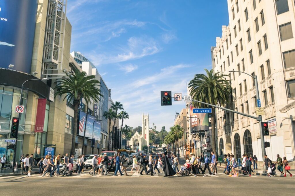 LOS ANGELES - MARCH 21, 2015: crowded street with multiracial people walking on Hollywood Boulevard the world famous Walk of Fame created in 1958 as a tribute to artists working in the movie industry.