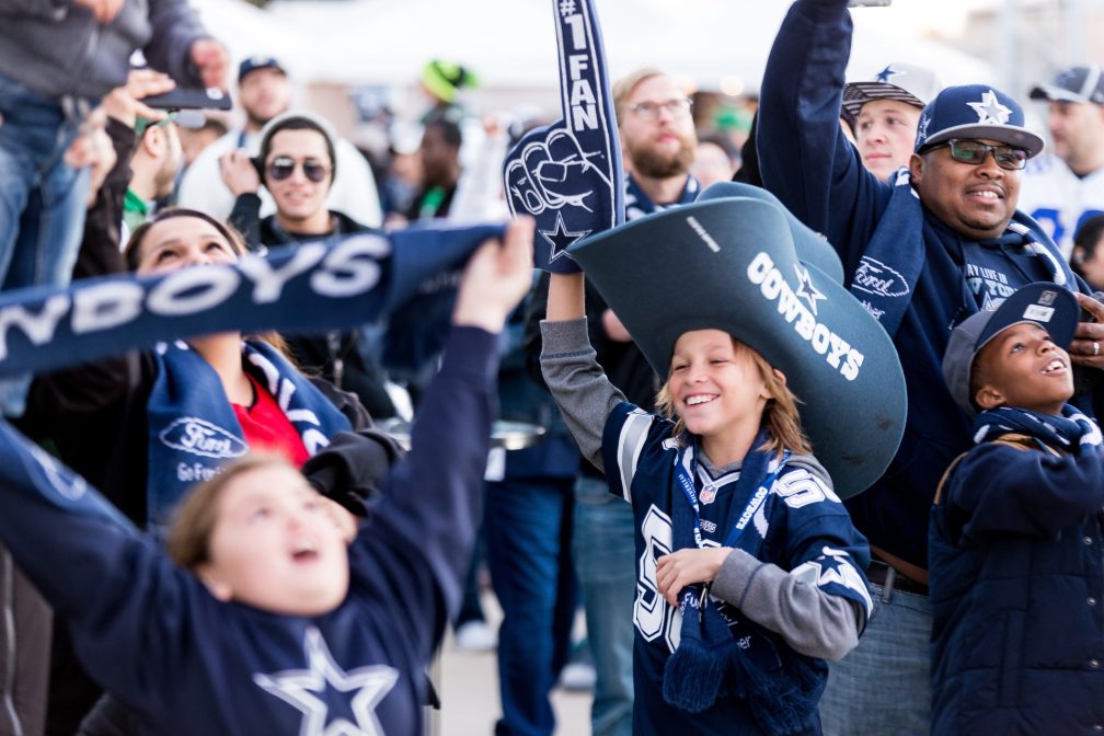 Young Dallas Cowboys Fan in a Big Cowboys Hat Outside AT&T Stadium