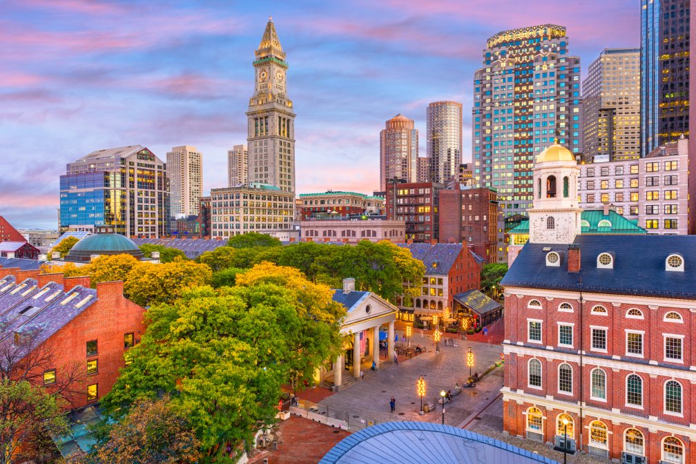 Boston, Massachusetts, USA skyline with Faneuil Hall and Quincy Market at dusk.