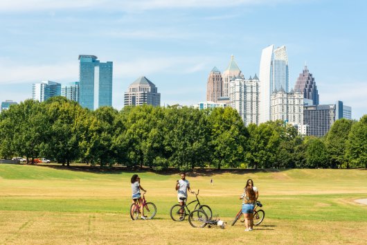 Atlanta, Georgia, United States of America  September 27, 2016. View of the the Midtown Skyline in Atlanta, GA, from the Piedmont Park, with people in the foreground.