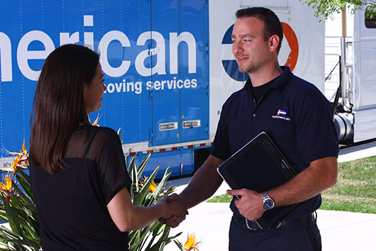 handshake between woman and mover. 