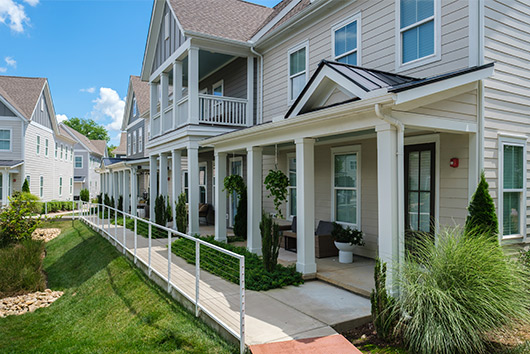 Townhomes at the Village at the Lake, showcasing modern architecture and scenic surroundings, ideal for new Nashville residents.